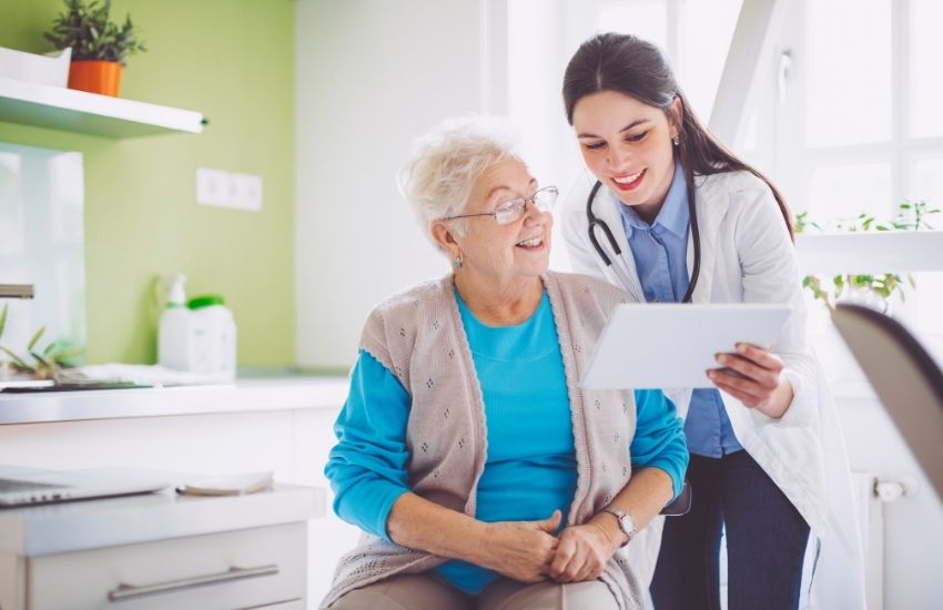 old lady and nurse talking
