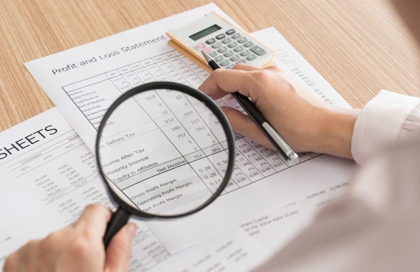 checking pager with Magnifying glass