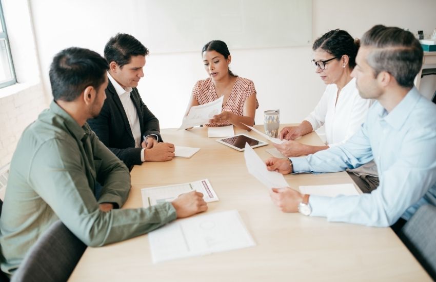 Group of people discussing about audit