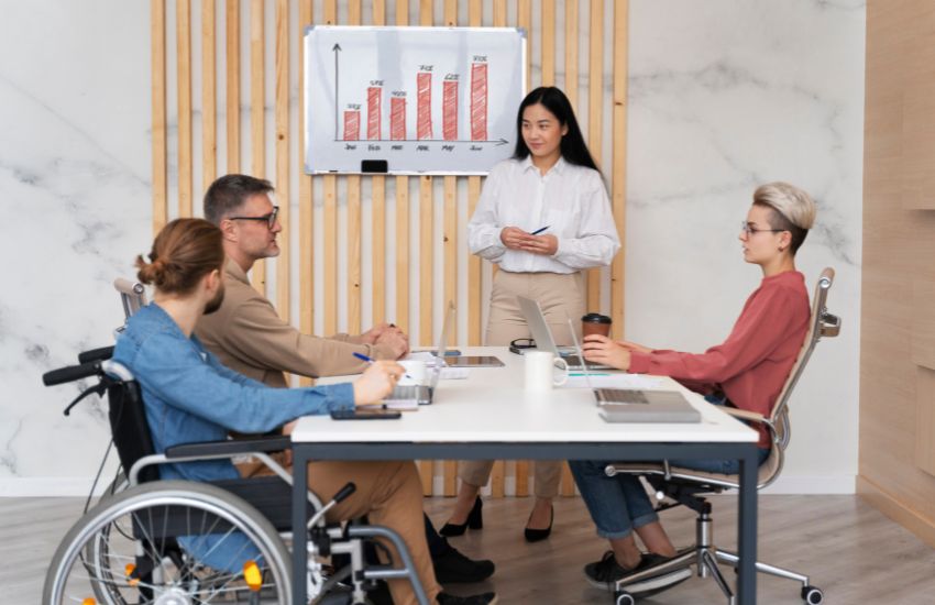 A woman in a wheelchair among a group of people