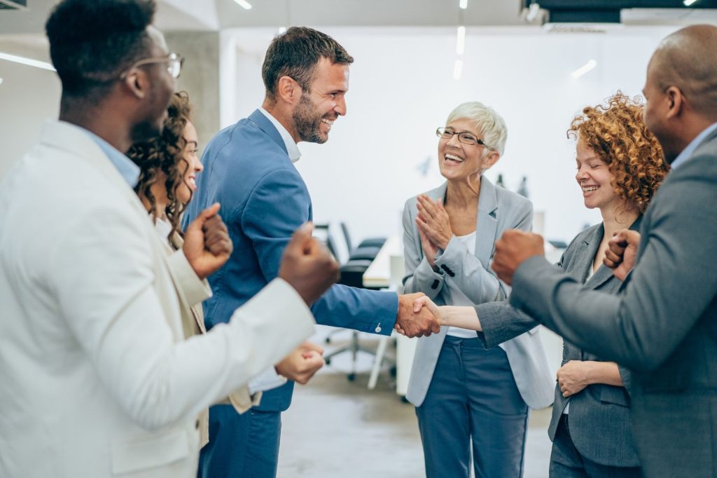 Group of people doing hand shake with each other