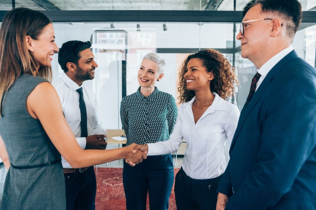 Group of people doing hand shake with each other